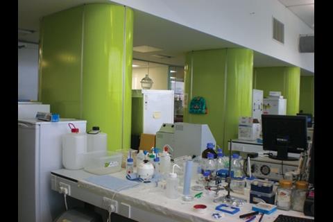 In the labs, lime-green risers direct services down from the ceilings to the benches